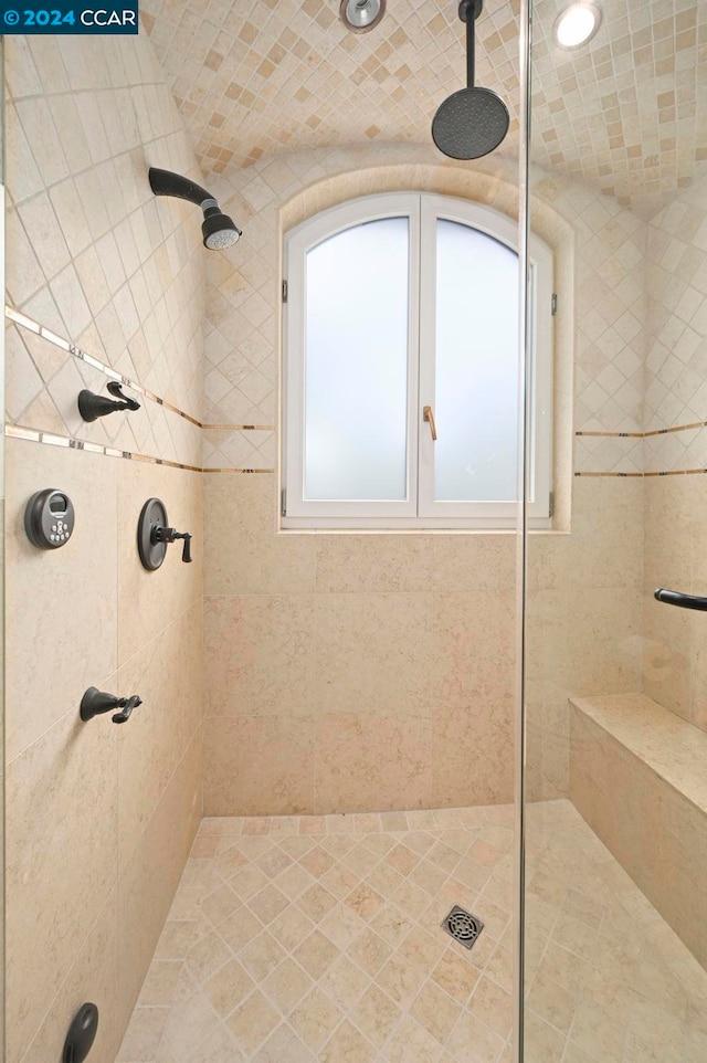 bathroom with tiled shower