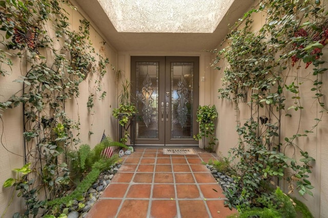 view of exterior entry featuring french doors