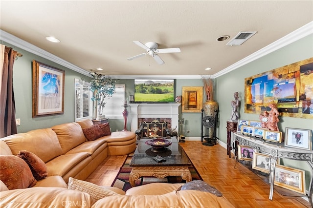 living room featuring a textured ceiling, ornamental molding, light parquet floors, and ceiling fan