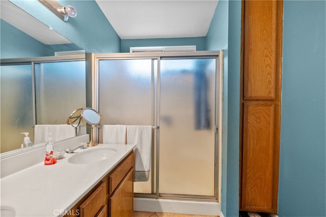 bathroom with vanity and walk in shower