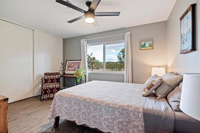 bedroom featuring ceiling fan and light hardwood / wood-style flooring