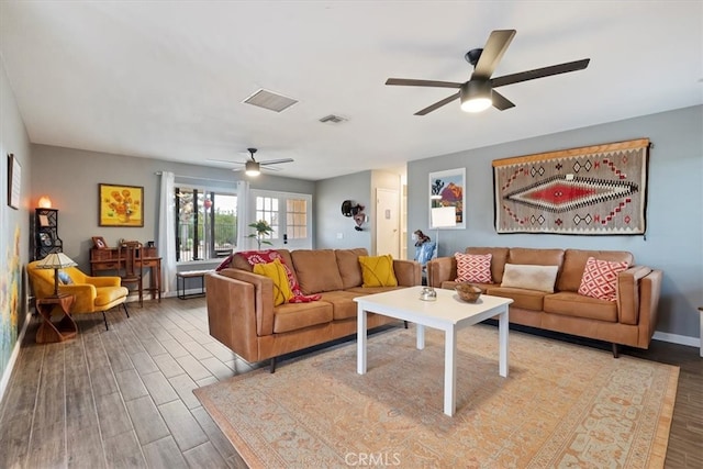 living room with light hardwood / wood-style floors and ceiling fan