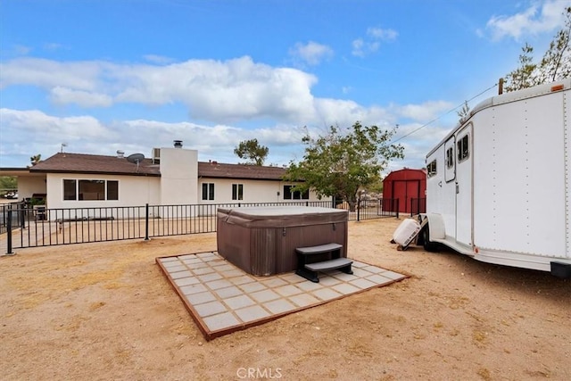 exterior space with a hot tub