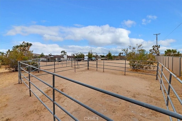 view of horse barn featuring a rural view