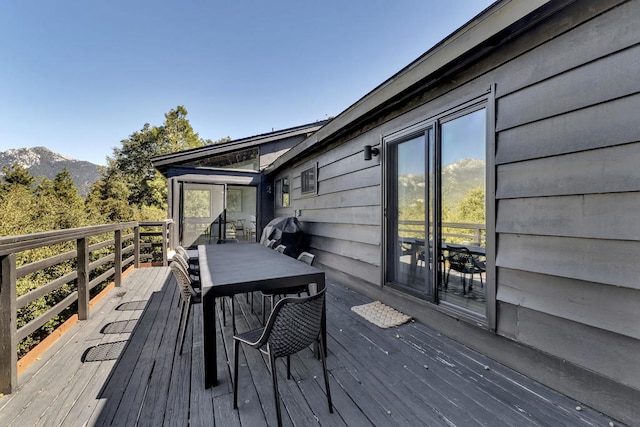 wooden deck featuring a mountain view