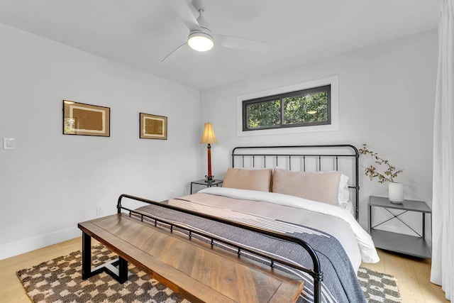 bedroom featuring light hardwood / wood-style floors and ceiling fan