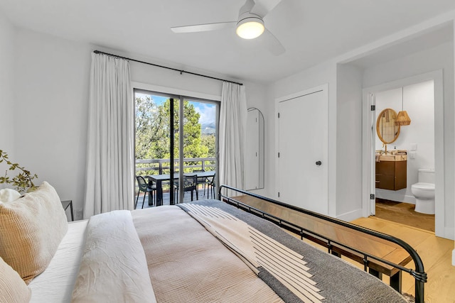 bedroom featuring ceiling fan, light hardwood / wood-style floors, ensuite bathroom, and access to exterior