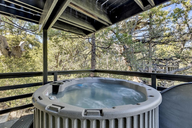 deck featuring area for grilling and a hot tub