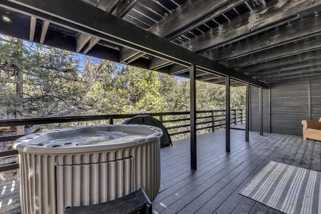 deck with a hot tub