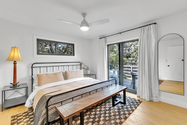 bedroom featuring access to outside, light hardwood / wood-style flooring, and ceiling fan