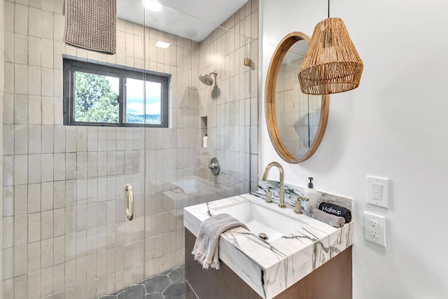 bathroom featuring vanity, tile patterned flooring, and an enclosed shower