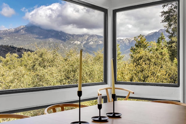 sunroom featuring a mountain view