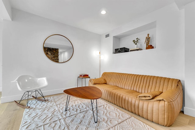 living room with light hardwood / wood-style flooring