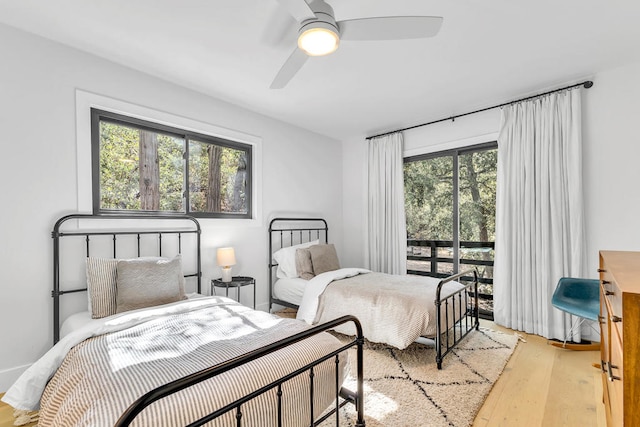 bedroom with light hardwood / wood-style floors and ceiling fan