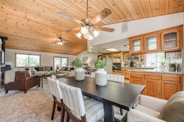18486 Tollhouse Rd, Clovis, CA 93619 - dining space featuring wood ceiling, lofted ceiling, light colored carpet, and a ceiling fan