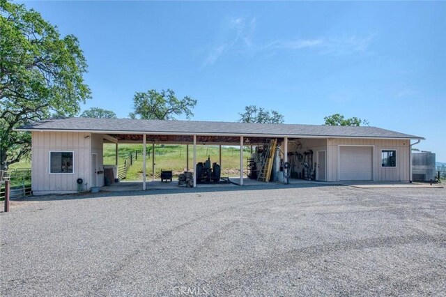 18486 Tollhouse Rd, Clovis, CA 93619 - view of front of house featuring an outbuilding, driveway, and an attached garage