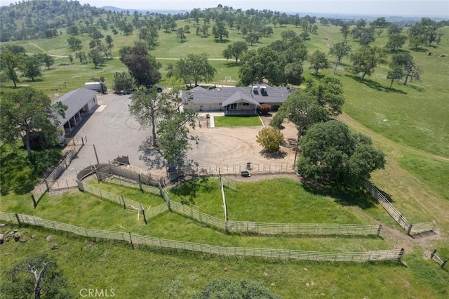 birds eye view of property with a rural view