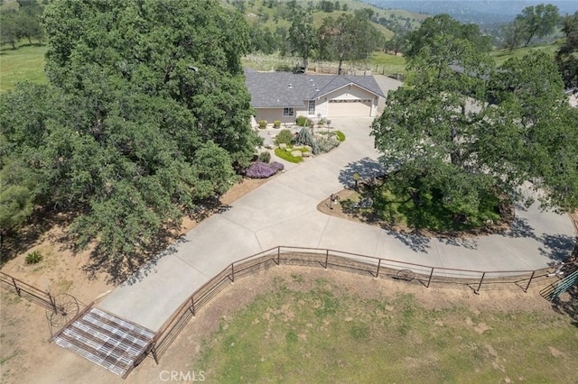 birds eye view of property with a rural view