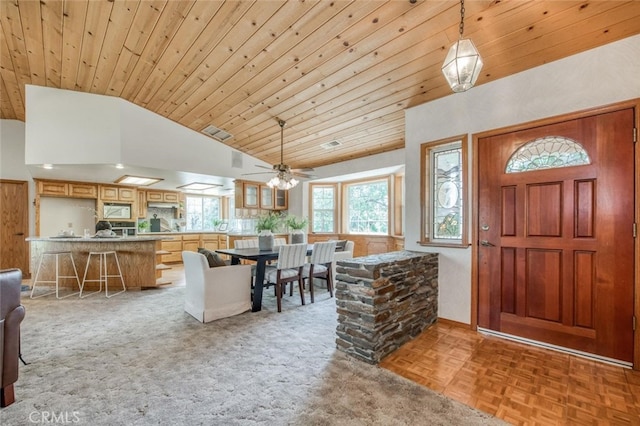 foyer featuring high vaulted ceiling, light parquet flooring, wooden ceiling, and ceiling fan