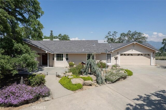 18486 Tollhouse Rd, Clovis, CA 93619 - ranch-style house with concrete driveway, a garage, and a shingled roof