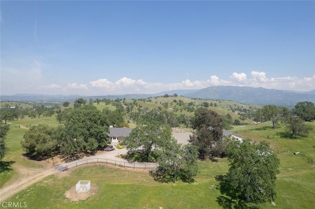 drone / aerial view featuring a mountain view and a rural view