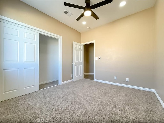 unfurnished bedroom featuring visible vents, baseboards, carpet, a closet, and recessed lighting