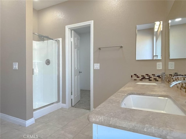 full bathroom with backsplash, a sink, and a shower stall