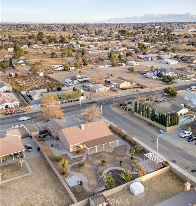 birds eye view of property with a mountain view