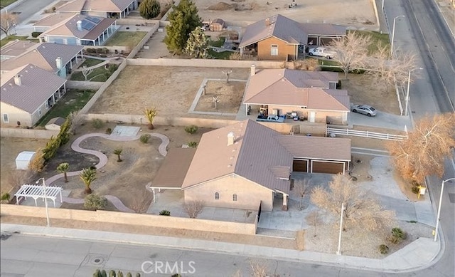 birds eye view of property with a residential view