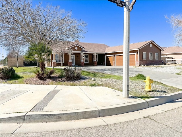 ranch-style home with driveway and an attached garage