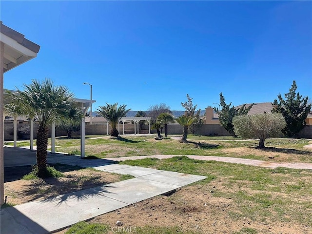 view of property's community with a pergola and a gazebo