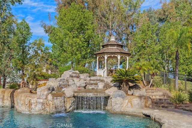 view of swimming pool featuring a gazebo