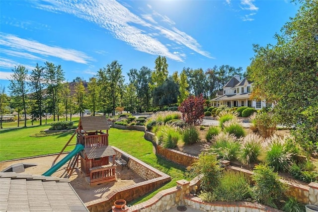 exterior space with a yard and a playground