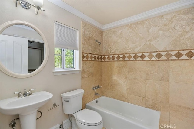 full bathroom featuring sink, toilet, ornamental molding, and tiled shower / bath