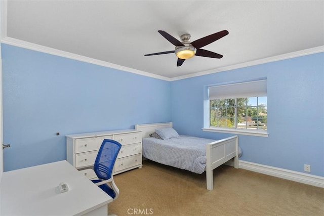 carpeted bedroom with ceiling fan and crown molding