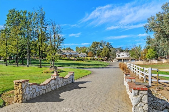 surrounding community featuring a lawn