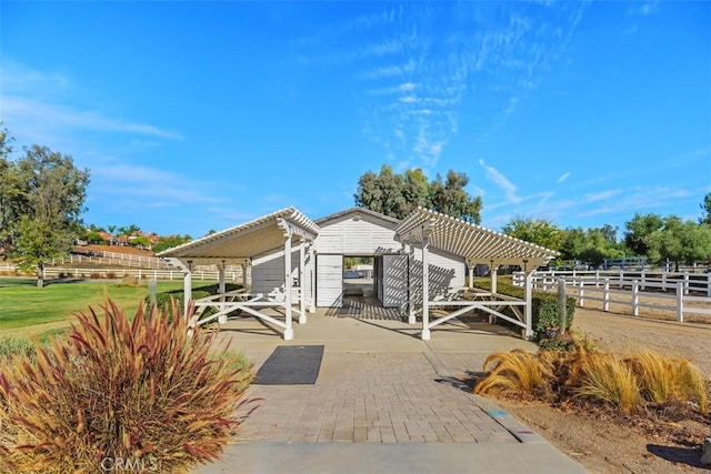 view of front of home with a pergola and a patio area