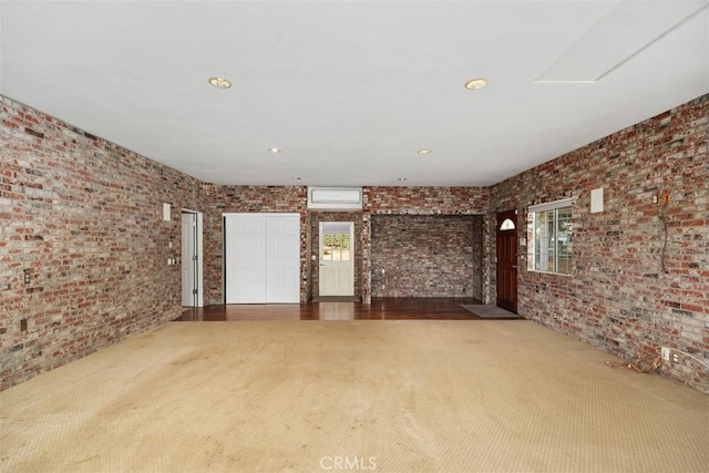 unfurnished living room featuring carpet flooring