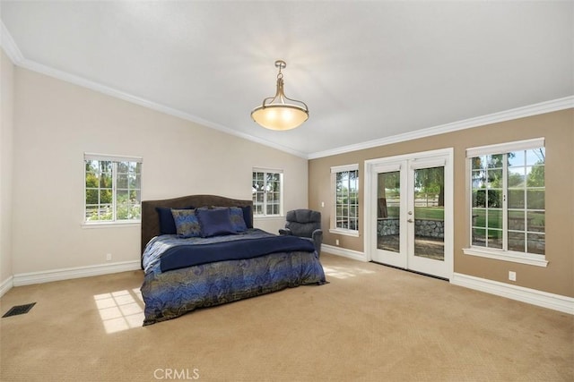 bedroom with lofted ceiling, access to outside, french doors, ornamental molding, and multiple windows