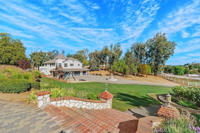 back of house featuring a yard and a patio