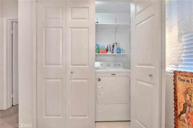 clothes washing area featuring washer / dryer