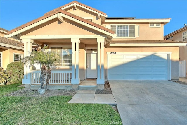 view of front facade featuring covered porch and a garage