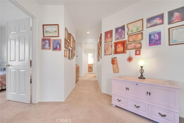 hallway with light colored carpet