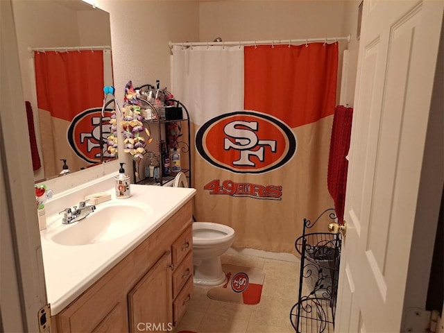 bathroom featuring vanity, a shower with curtain, toilet, and tile patterned floors