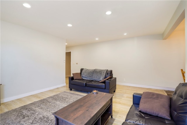 living room with light hardwood / wood-style flooring