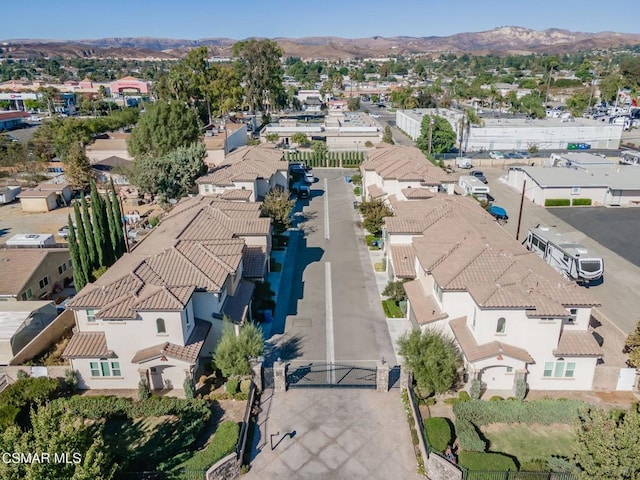 birds eye view of property featuring a mountain view