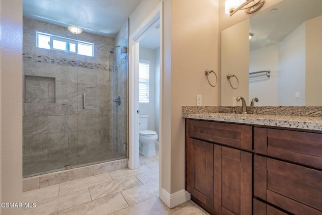 bathroom with vanity, toilet, and walk in shower