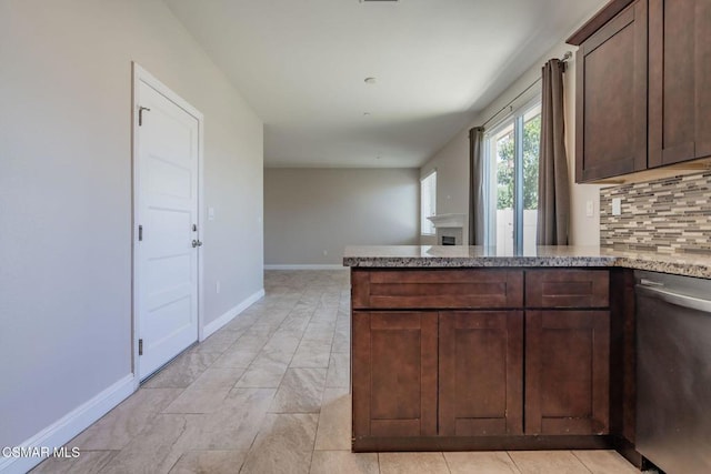 kitchen with dishwasher, decorative backsplash, kitchen peninsula, and dark brown cabinets