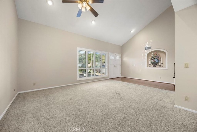 unfurnished living room featuring ceiling fan, carpet, and high vaulted ceiling