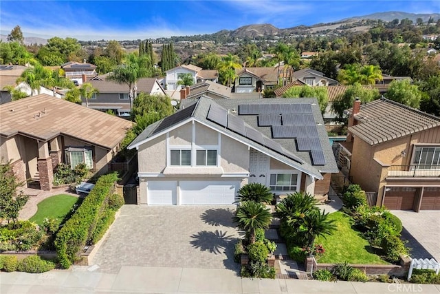 birds eye view of property with a mountain view